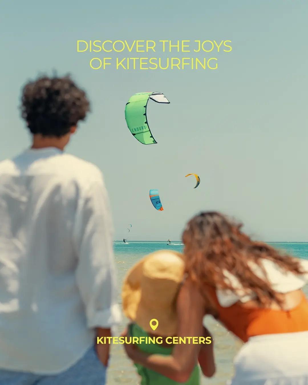 People watching colorful kitesurfers over the Red Sea at El Gouna kitesurfing centers.