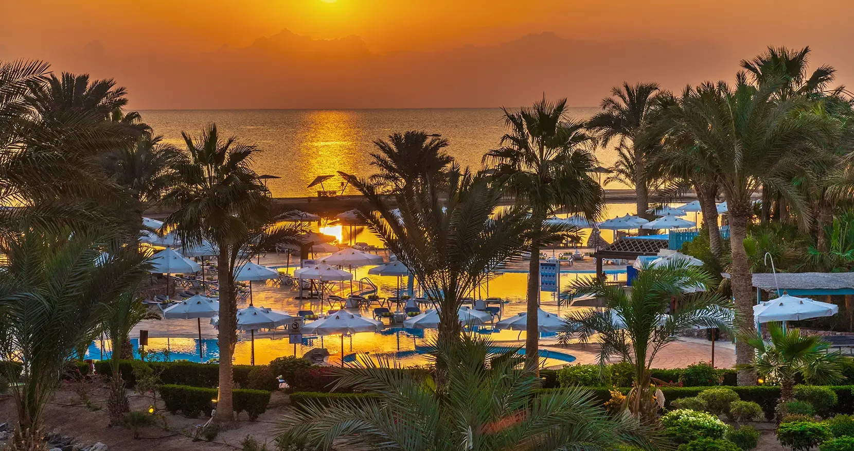 A sunrise view at Mövenpick El Gouna Red Sea, capturing the peaceful morning atmosphere by the water.