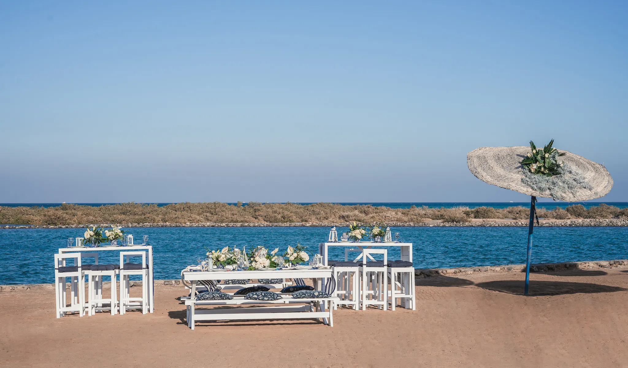 White wedding tables beside the Red Sea in El Gouna